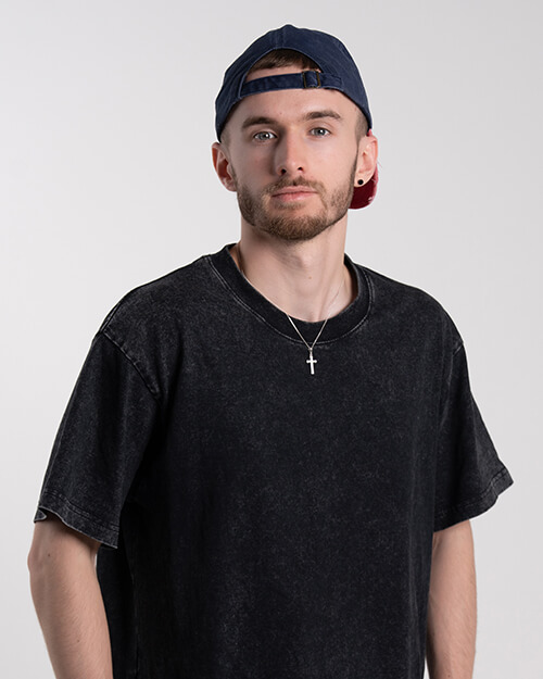 Luke standing and looking at camera